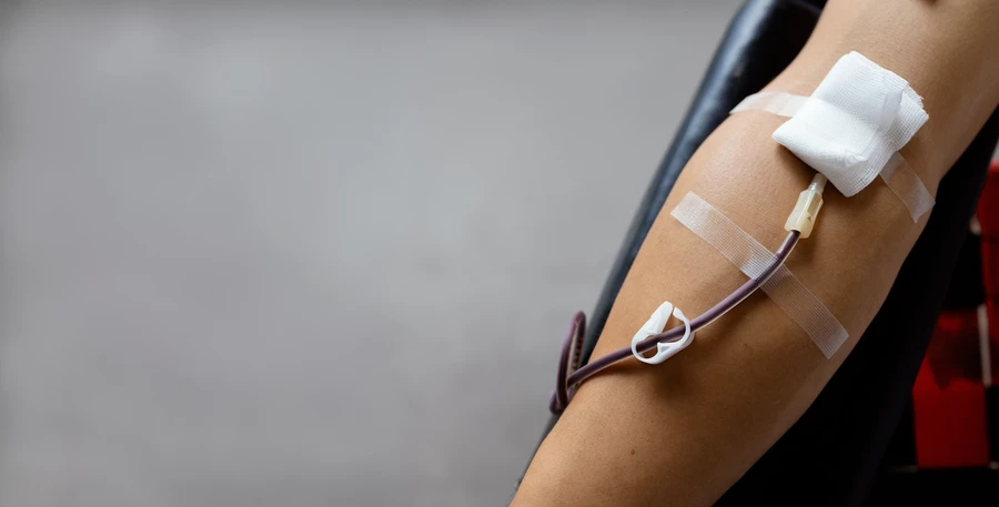 An arm of someone giving blood.