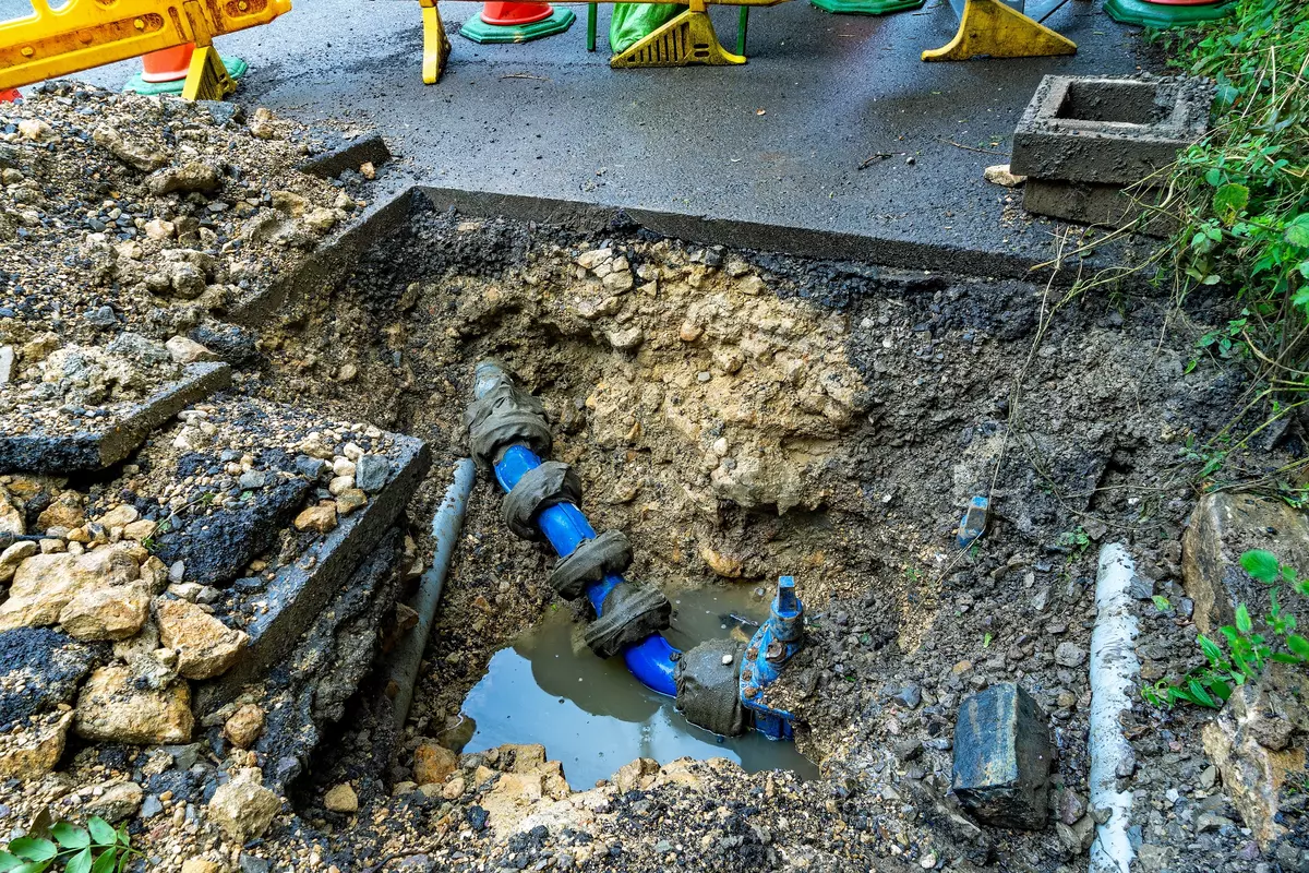 Water main construction with blue PVC water pipes